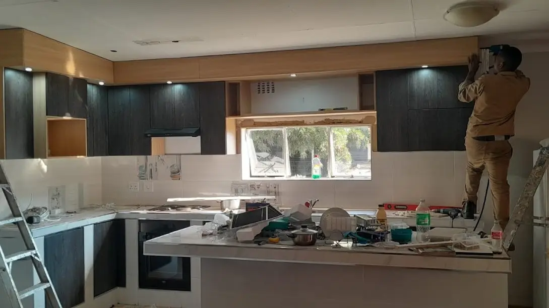 KING CABINET fitting a kitchen on site in Kempton Park